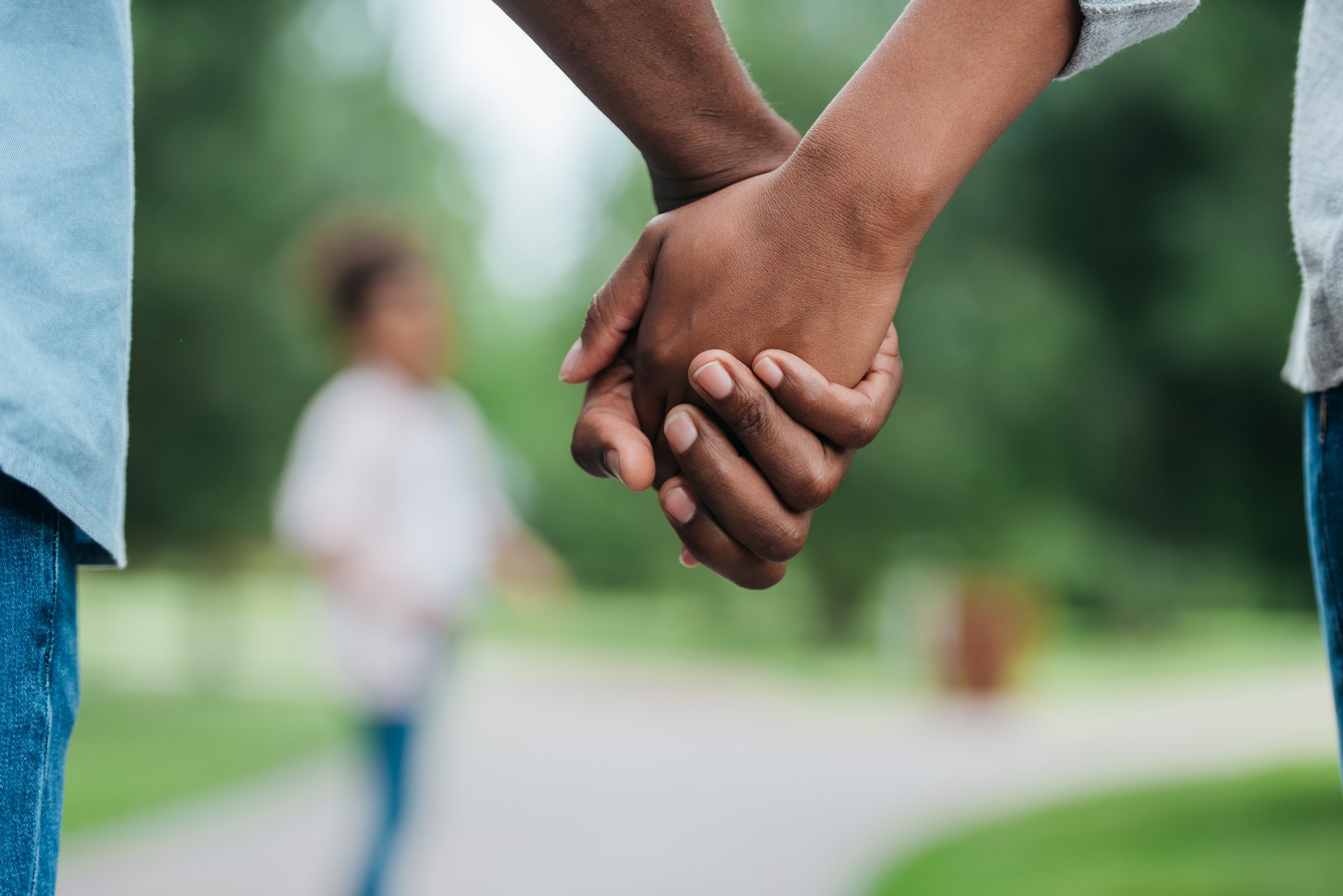cropped shot of african american couple holding hands